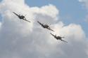 North American Aviation P-51 Mustang three-ship formation at Duxford Flying Legends 2009