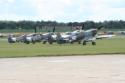 Four Supermarine Spitfires lined up ready for takeoff at Duxford Flying Legends 2009