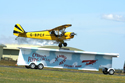 O Briens Flying Circus Aerobatic Stunt Team Piper Cub landing on a moving trailer at Kemble Air Show 2010