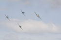 Hispano Buchon being chased by Supermarine Spitfires in dogfight at RAF Waddington Air Show 2010
