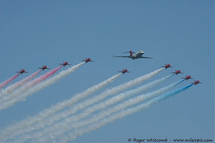 A special flypast by the Red Arrows with a 5 Squadron Sentinel aircraft with special tail art, celebrating 100 years at Waddington Air Show 2013