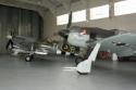 Pitts Special G-AXNZ, Supermarine Spitfire Mk IX G-IXCC PL344 and Focke-Wulf Fw 190 A8/N G-FWAB at Duxford Hangar 2 - The Flying Museum