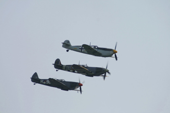 Supermarine Spitfire Mk IX G-CCCA IAC-161 formerly PV202, Supermarine Spitfire Mk IX G-IXCC PL344 and Hispano Aviación HA-1112-M1L Buchon 223 G-BWUE (Ex C.4K-102 of the Spanish Air Force) at The Gathering of Warbirds & Veterans - Departures at North Weald